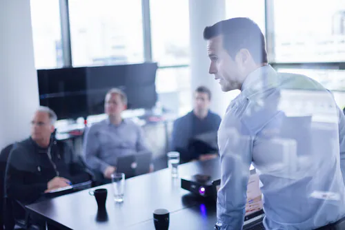 image of man showing clients business idea